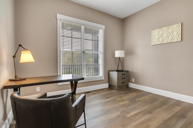 14737 Washington Way, Bristol, VA 24202 - office with a healthy amount of sunlight, baseboards, wood finished floors, and visible vents
