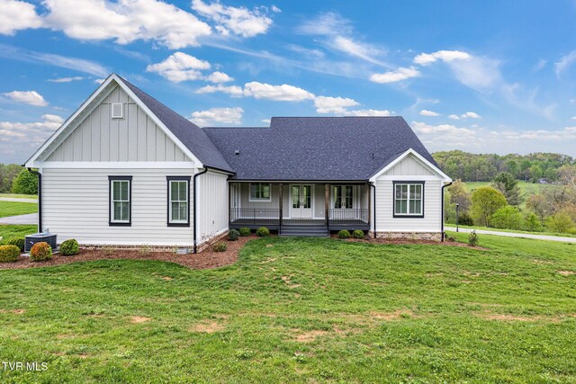 14737 Washington Way, Bristol, VA 24202 - modern farmhouse featuring roof with shingles, covered porch, board and batten siding, and a front lawn