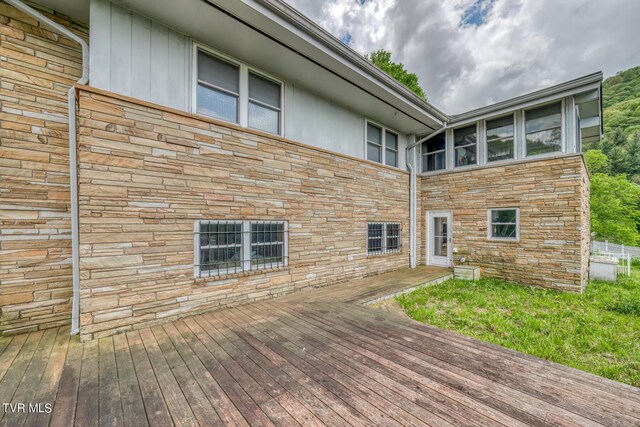 1010 Heaton Creek Rd, Roan Mountain, TN 37687 - back of property with stone siding and a deck