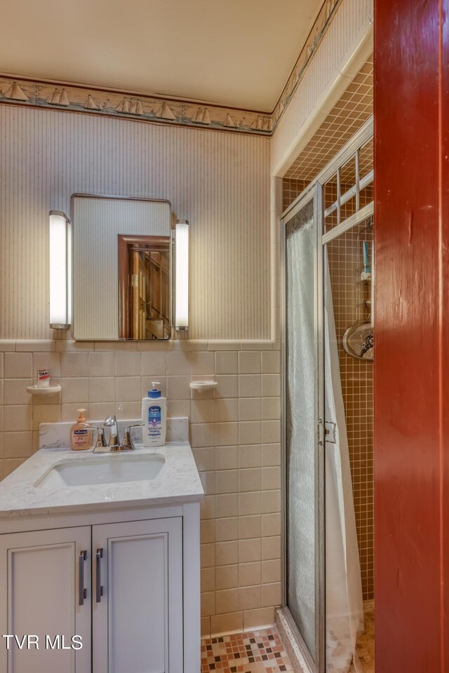 1010 Heaton Creek Rd, Roan Mountain, TN 37687 - bathroom featuring a shower stall, tile walls, and vanity