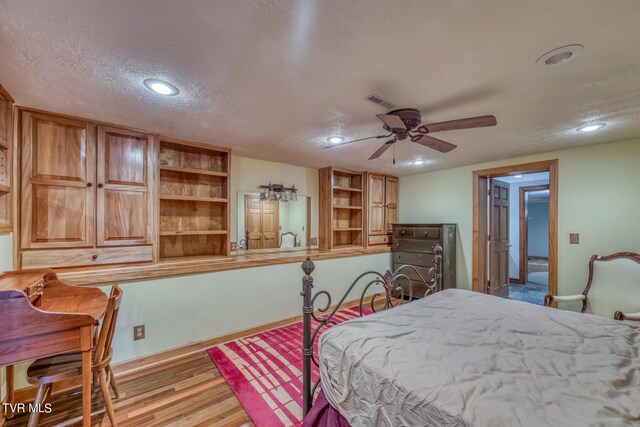 1010 Heaton Creek Rd, Roan Mountain, TN 37687 - bedroom featuring light wood-style flooring, visible vents, recessed lighting, and a textured ceiling