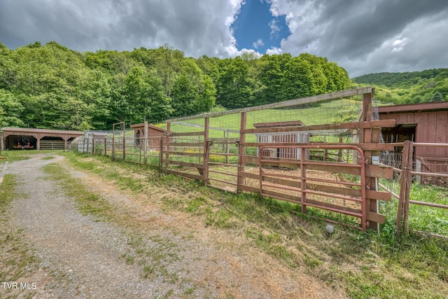 1010 Heaton Creek Rd, Roan Mountain, TN 37687 - exterior space featuring a view of trees, an outbuilding, and an exterior structure