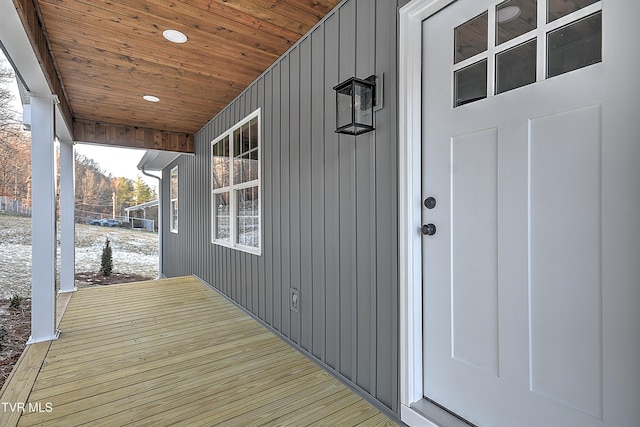 view of exterior entry featuring board and batten siding