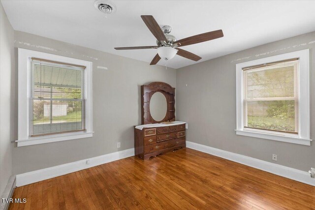 800 Pearl St, Bristol, VA 24201 - unfurnished bedroom featuring visible vents, wood finished floors, and baseboards
