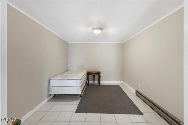bedroom with ornamental molding, light tile patterned flooring, baseboards, and a baseboard radiator