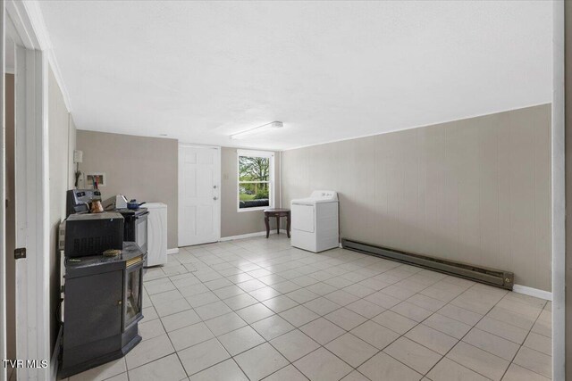 800 Pearl St, Bristol, VA 24201 - empty room featuring a baseboard heating unit, light tile patterned floors, and washer / dryer