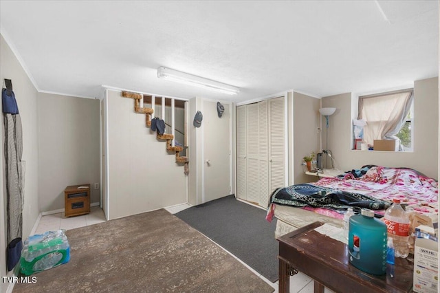 carpeted bedroom with a closet