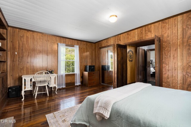 bedroom featuring wooden walls, ornamental molding, and wood finished floors