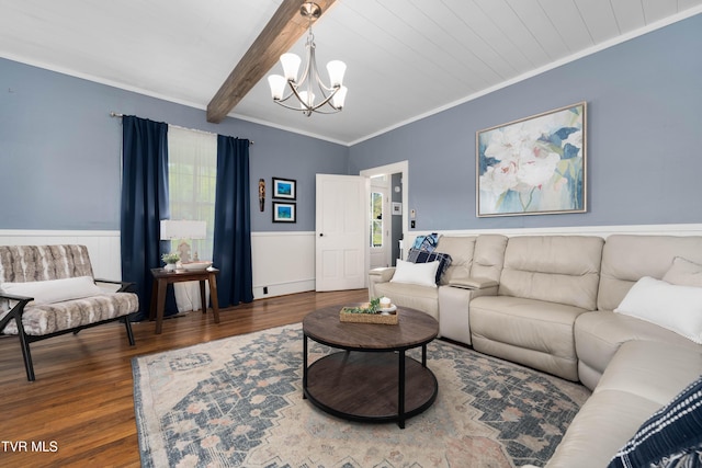 living room with a chandelier, ornamental molding, and a wealth of natural light