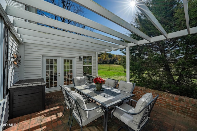 view of patio featuring a pergola, french doors, and outdoor dining area