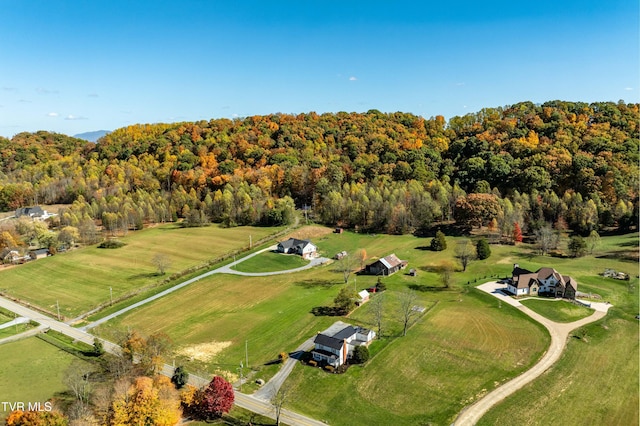 birds eye view of property with a rural view and a forest view