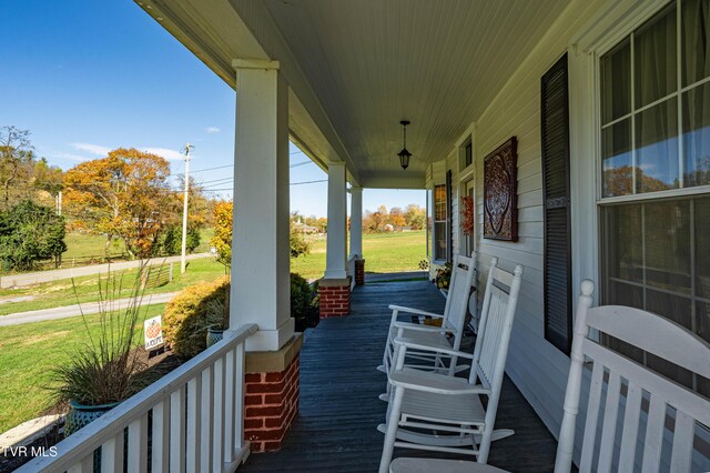 wooden deck featuring covered porch