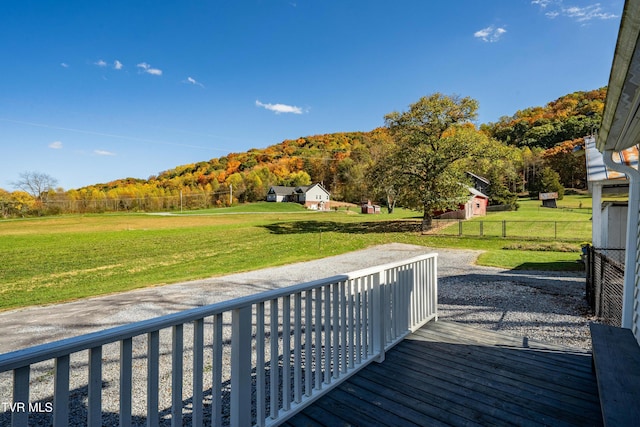 deck with a yard and fence