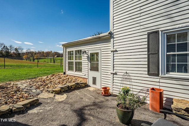 exterior space with a patio, a yard, and fence