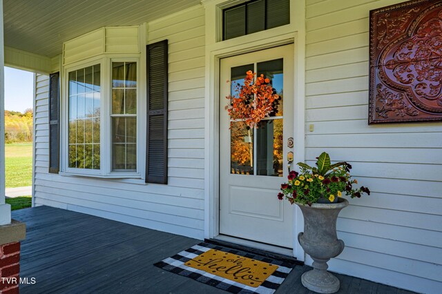 property entrance with covered porch