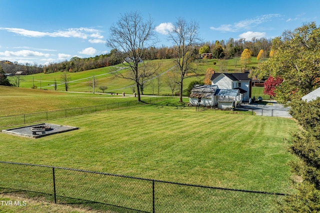 view of yard featuring a rural view and fence