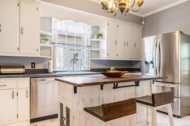 kitchen featuring wooden counters, a chandelier, open shelves, and appliances with stainless steel finishes