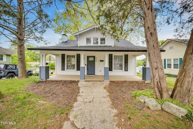 718 Wilson Ave, Johnson City, TN 37604 - bungalow with a chimney, a porch, and a shingled roof