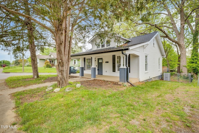 718 Wilson Ave, Johnson City, TN 37604 - view of front facade featuring fence, a porch, cooling unit, and a front yard