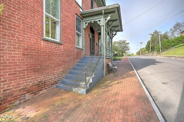view of property exterior featuring brick siding