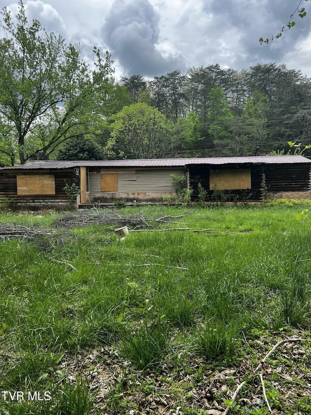 exterior space with metal roof