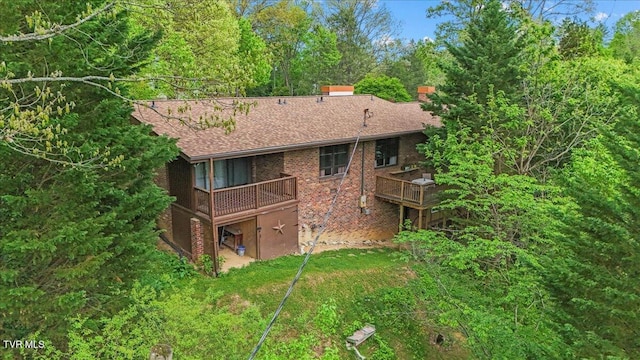 1902 Lamont St, Kingsport, TN 37664 - rear view of house featuring a deck, brick siding, a chimney, and a shingled roof