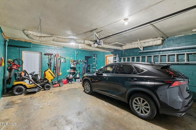 1902 Lamont St, Kingsport, TN 37664 - garage featuring concrete block wall and a garage door opener
