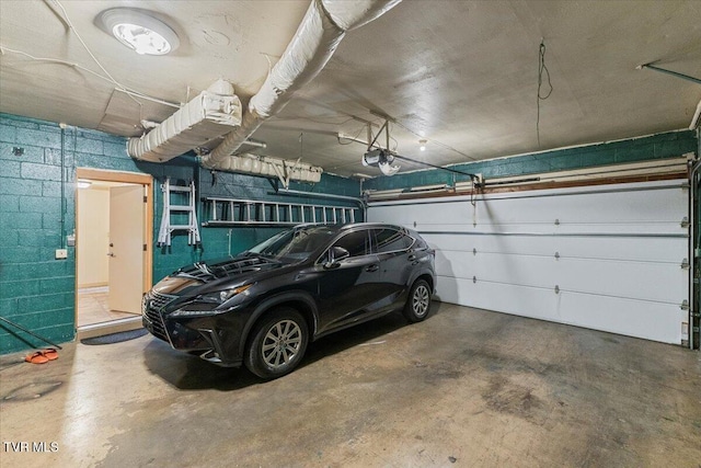 1902 Lamont St, Kingsport, TN 37664 - garage with concrete block wall and a garage door opener