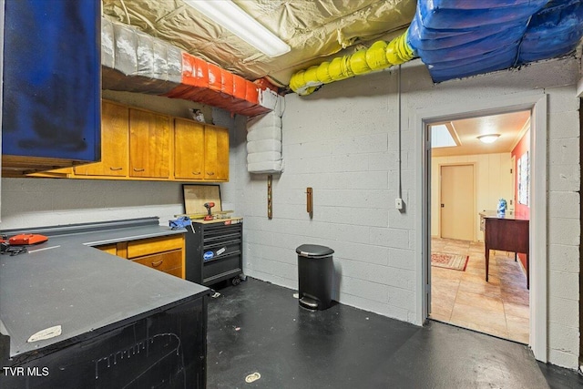 1902 Lamont St, Kingsport, TN 37664 - kitchen with concrete flooring and brown cabinetry
