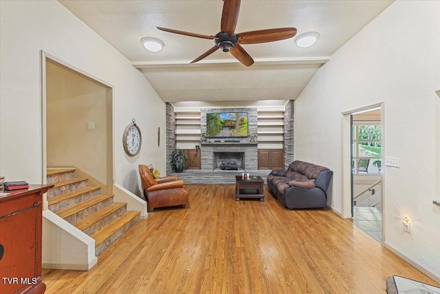 1902 Lamont St, Kingsport, TN 37664 - living room featuring wood finished floors, a fireplace, baseboards, stairway, and a ceiling fan