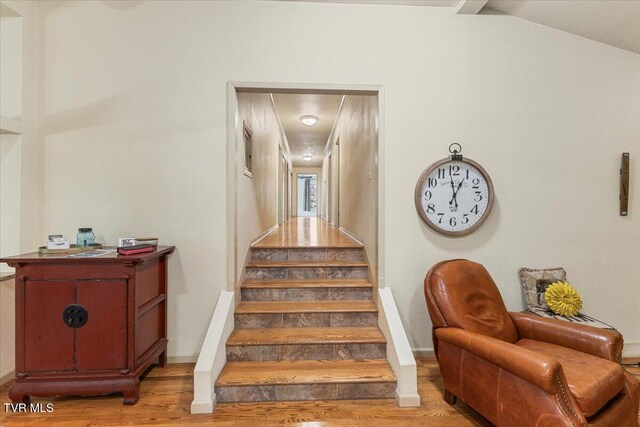 1902 Lamont St, Kingsport, TN 37664 - stairs featuring lofted ceiling, wood finished floors, and baseboards