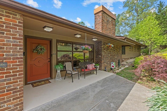 1902 Lamont St, Kingsport, TN 37664 - view of exterior entry featuring brick siding and a chimney