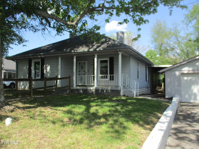1209 Golf St, Bristol, TN 37620 - bungalow-style home featuring driveway, a chimney, a front yard, a porch, and a garage