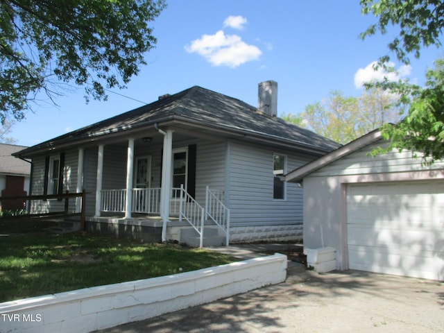 1209 Golf St, Bristol, TN 37620 - view of front facade featuring driveway, a garage, covered porch, and a chimney
