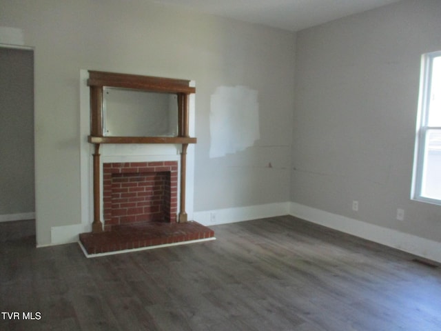 1209 Golf St, Bristol, TN 37620 - unfurnished living room featuring baseboards, wood finished floors, and a fireplace