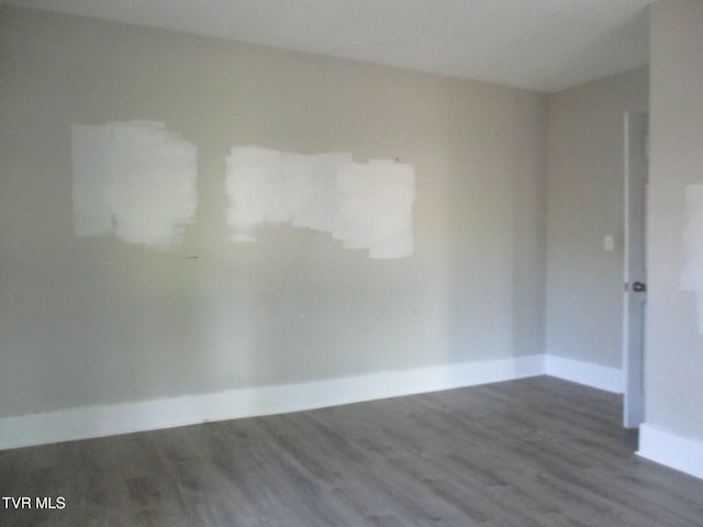 1209 Golf St, Bristol, TN 37620 - empty room featuring wood finished floors and baseboards