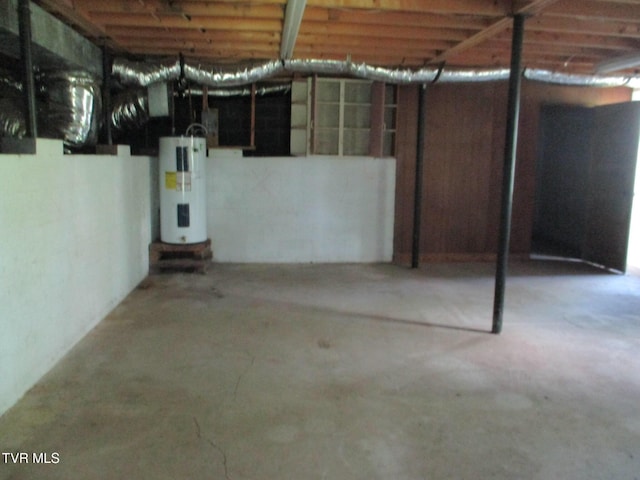 1209 Golf St, Bristol, TN 37620 - unfinished basement featuring electric water heater