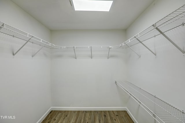spacious closet with wood finished floors