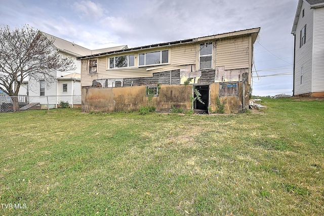 back of house with a yard