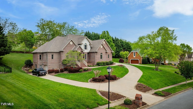 traditional-style house featuring a front lawn, concrete driveway, and brick siding