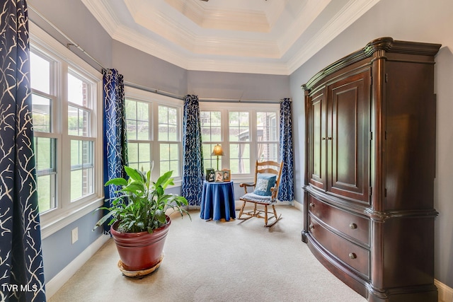 sitting room with baseboards, ornamental molding, carpet, and a tray ceiling