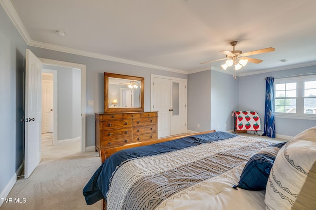 bedroom with light carpet, crown molding, and baseboards