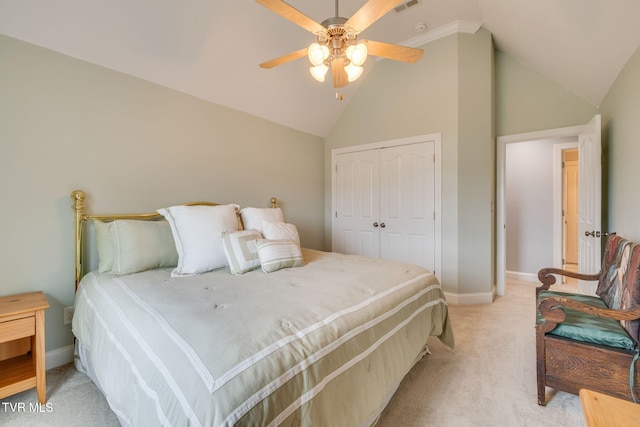 bedroom with ceiling fan, a closet, baseboards, and light carpet