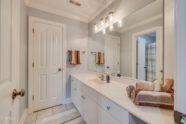 full bath with tile patterned floors, ornamental molding, vanity, baseboards, and visible vents