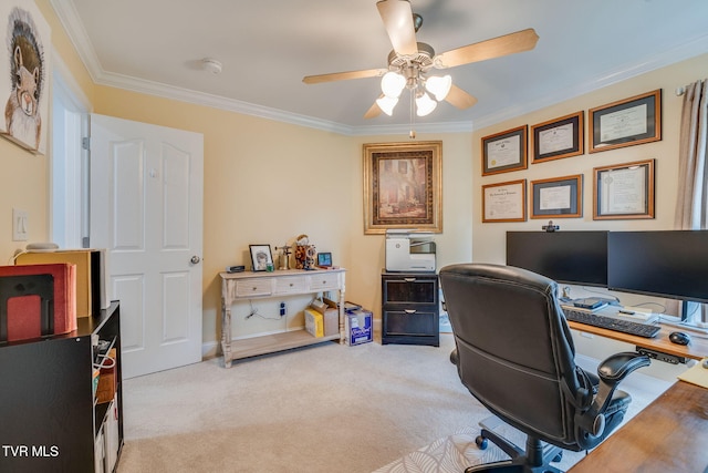home office featuring ceiling fan, ornamental molding, and light carpet