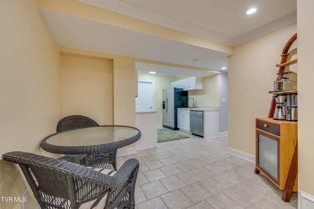 dining space featuring baseboards, recessed lighting, and ornamental molding