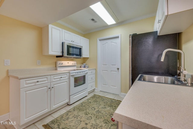 kitchen featuring white range with electric stovetop, stainless steel microwave, ornamental molding, and a sink