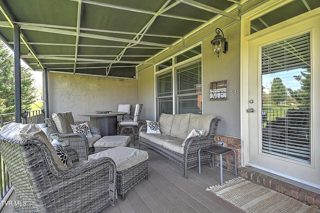 deck with an outdoor hangout area