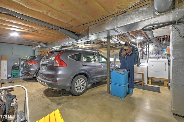 interior space with a garage door opener and washing machine and dryer