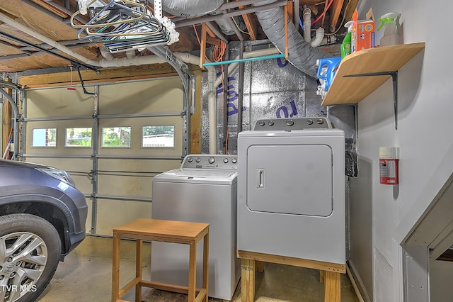 washroom featuring laundry area and washing machine and dryer